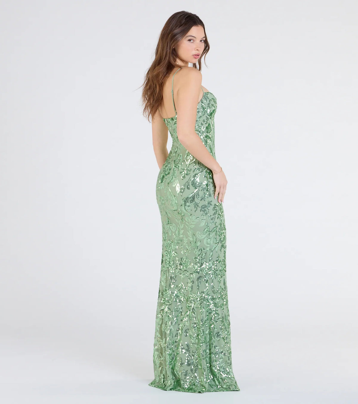 The Carrie Sequin Corset Mermaid Dress in sage is a stunning green prom dress designed to capture attention with its fresh or bold color and effortlessly stylish silhouette.