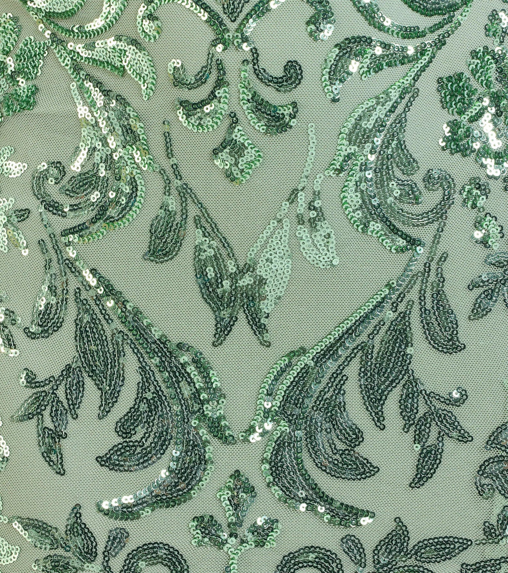 Make a bold statement in the Carrie Sequin Corset Mermaid Dress in sage green, the perfect green dress for weddings, cocktail hours, nights out, and/or seasonal celebrations.