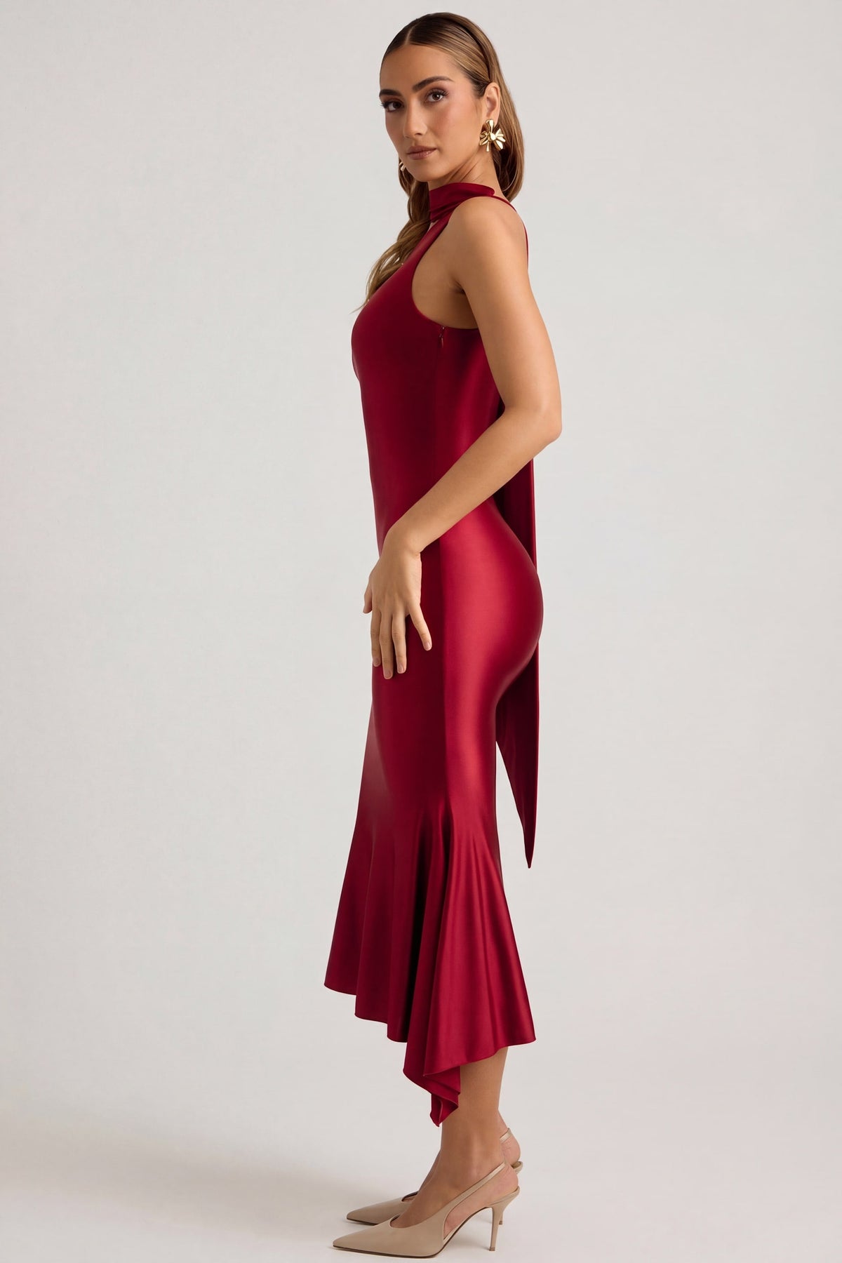 Oh Polly's Priscilla wearing the Shaya Midaxi Dress in True Red Satin Jersey fabric perfect for festive gatherings